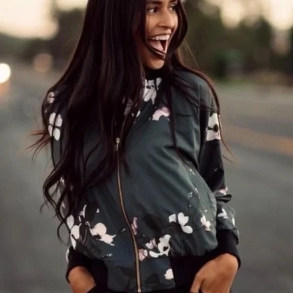 Albion women’s Orchard blossom floral green bomber jacket.